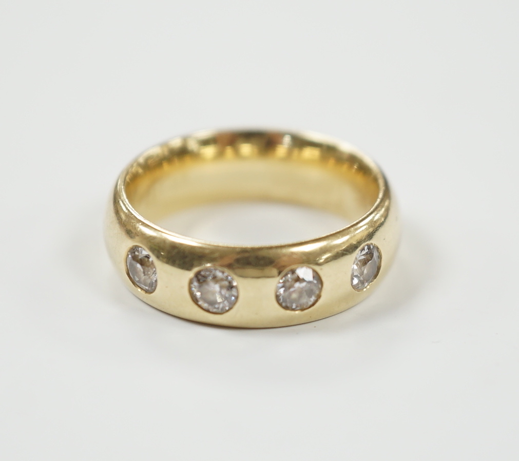 A 14k and four stone gypsy set diamond ring, size J/K, gross weight 7.4 grams.